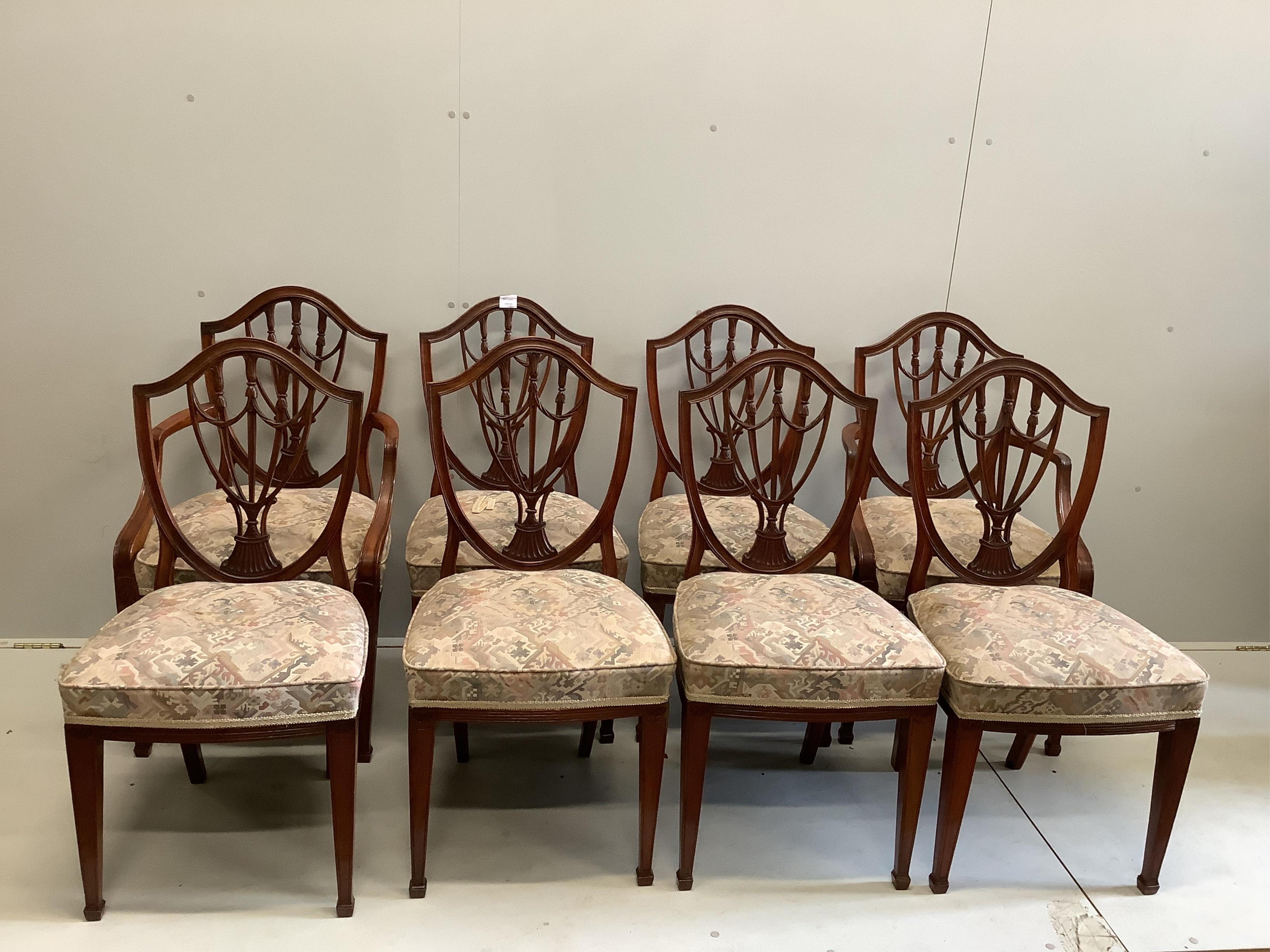 A set of eight reproduction Hepplewhite style mahogany shield back dining chairs, two with arms. Condition - fair